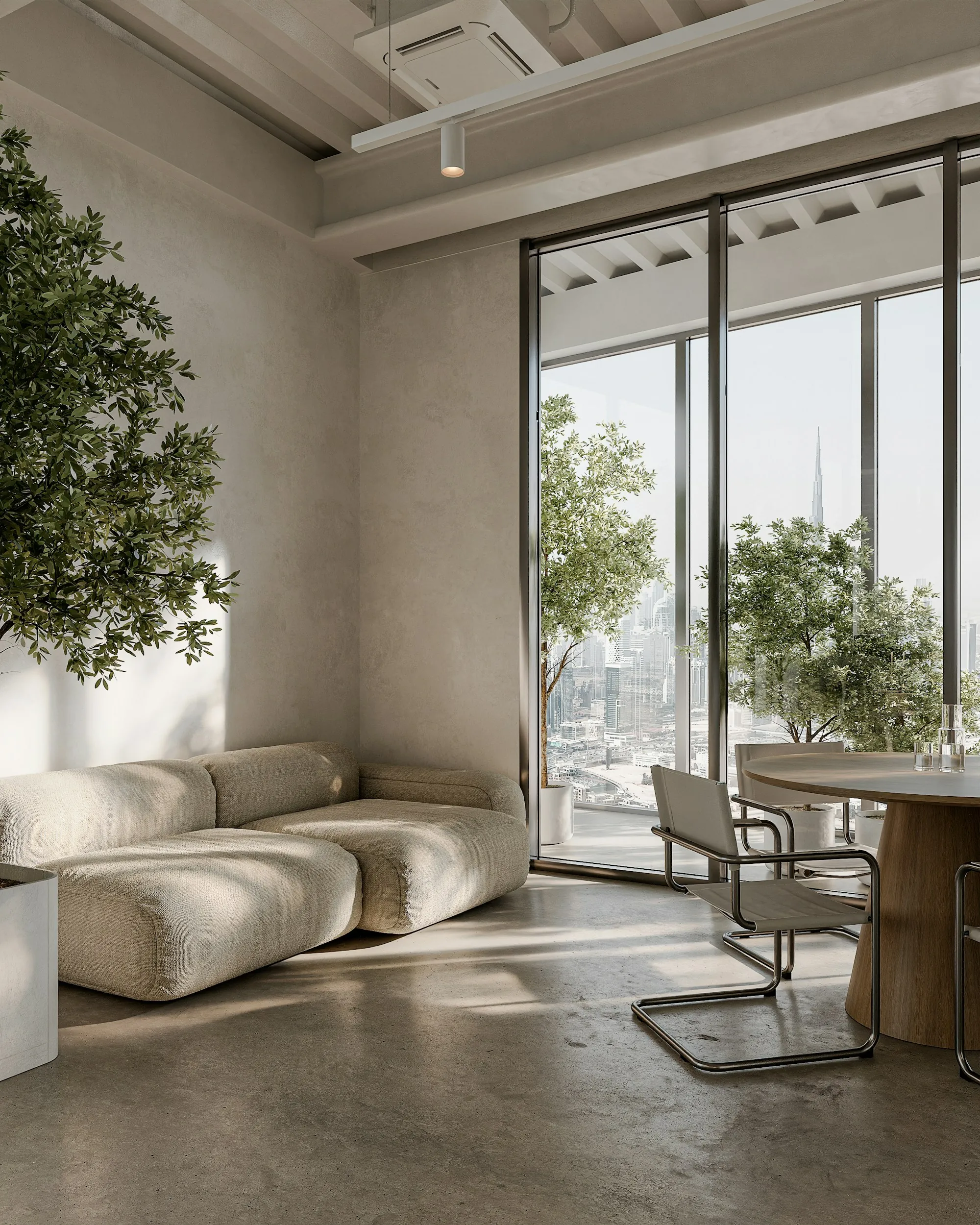 Office lounge with a sofa, plants and city views